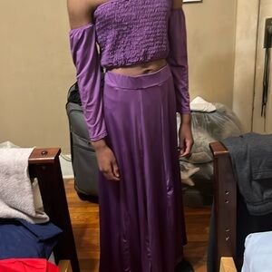 Women’s two piece dress with off the shoulder sleeves and slit down skirt.